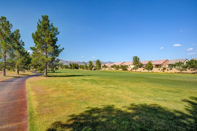 7916 Lyrebird Dr, North Las Vegas, NV 89084 - view of community with a lawn, a residential view, and a mountain view