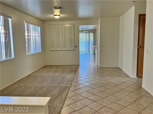 338 Brilliant Summit Cir, Henderson, NV 89052 - empty room with light tile patterned floors and a ceiling fan