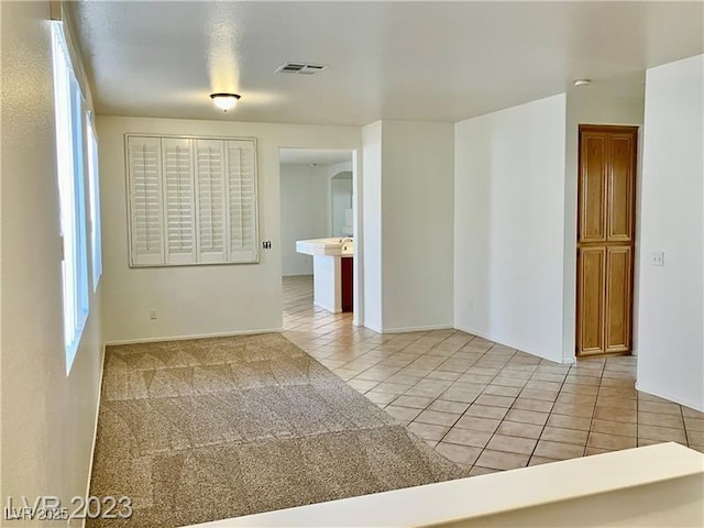 338 Brilliant Summit Cir, Henderson, NV 89052 - empty room featuring light tile patterned floors and baseboards
