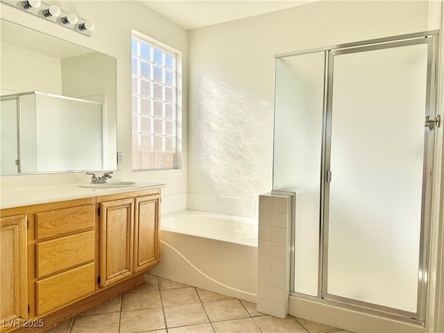 338 Brilliant Summit Cir, Henderson, NV 89052 - full bathroom with a stall shower, a garden tub, vanity, and tile patterned flooring