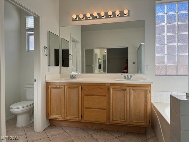 338 Brilliant Summit Cir, Henderson, NV 89052 - bathroom featuring tile patterned floors, a bath, and double vanity