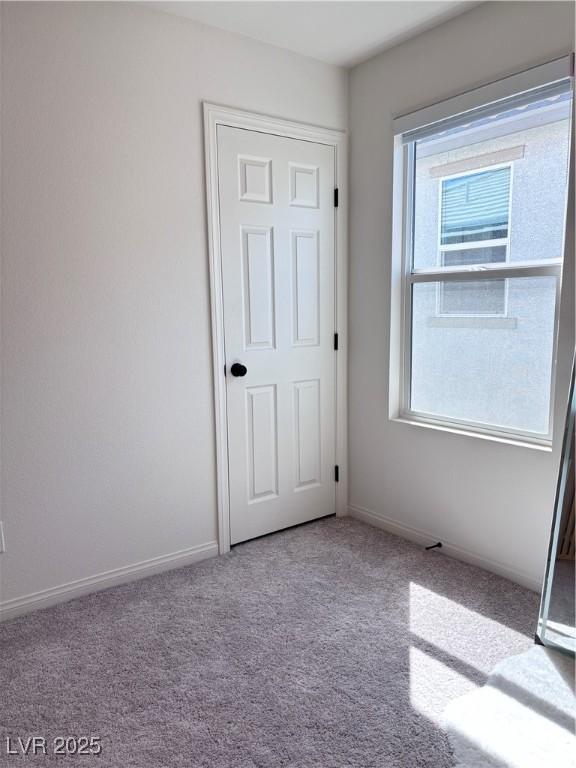 4993 Birchland Manor Ave, Las Vegas, NV 89139 - unfurnished bedroom featuring carpet floors and baseboards