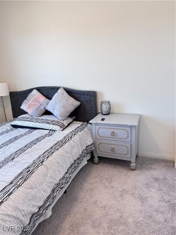 4993 Birchland Manor Ave, Las Vegas, NV 89139 - bedroom with light carpet and baseboards