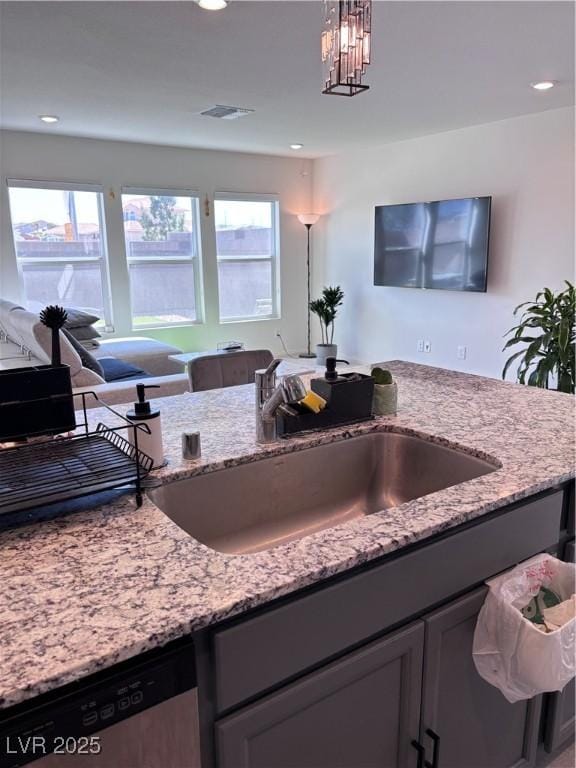 4993 Birchland Manor Ave, Las Vegas, NV 89139 - kitchen with dishwasher, light stone countertops, decorative light fixtures, recessed lighting, and open floor plan