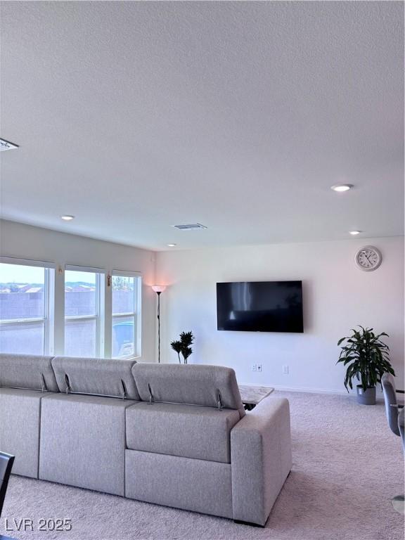 4993 Birchland Manor Ave, Las Vegas, NV 89139 - carpeted living room featuring a textured ceiling and recessed lighting