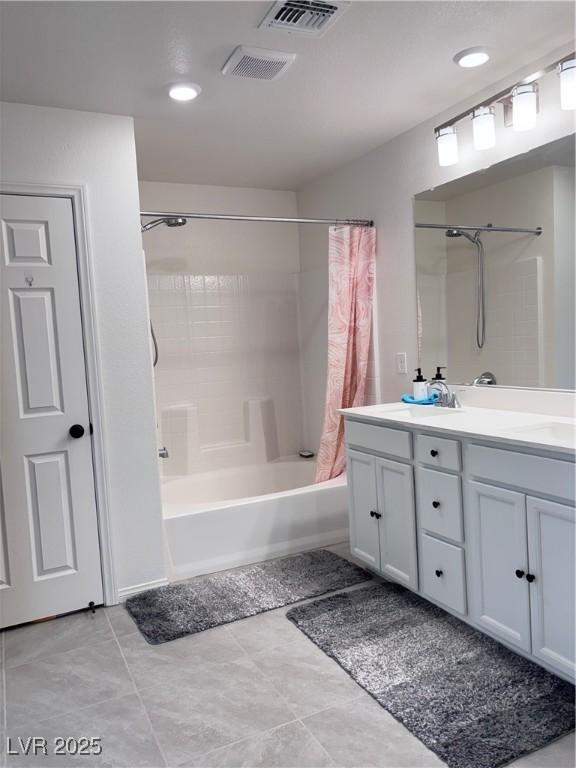 4993 Birchland Manor Ave, Las Vegas, NV 89139 - bathroom with shower / bathtub combination with curtain and double vanity