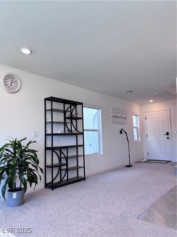 4993 Birchland Manor Ave, Las Vegas, NV 89139 - unfurnished living room with baseboards and recessed lighting