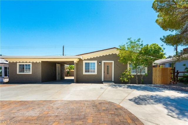 1916 Howard Ave, Las Vegas, NV 89104 - single story home with stucco siding, an attached carport, and concrete driveway