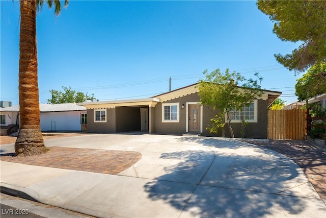 1916 Howard Ave, Las Vegas, NV 89104 - ranch-style house with concrete driveway, stucco siding, and a carport