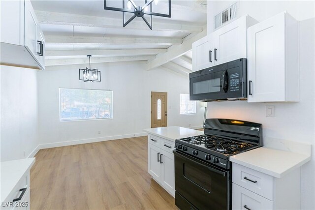 1916 Howard Ave, Las Vegas, NV 89104 - kitchen featuring black appliances, a chandelier, light wood-type flooring, and white cabinets