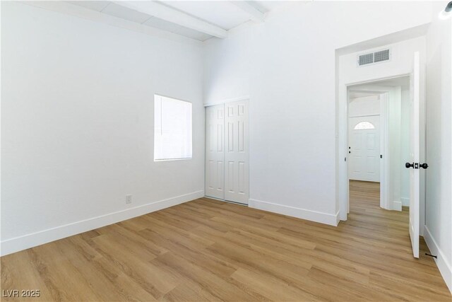 1916 Howard Ave, Las Vegas, NV 89104 - spare room featuring light wood finished floors and beam ceiling