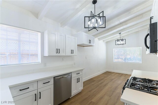 1916 Howard Ave, Las Vegas, NV 89104 - kitchen featuring a chandelier, dishwasher, black microwave, and healthy amount of natural light