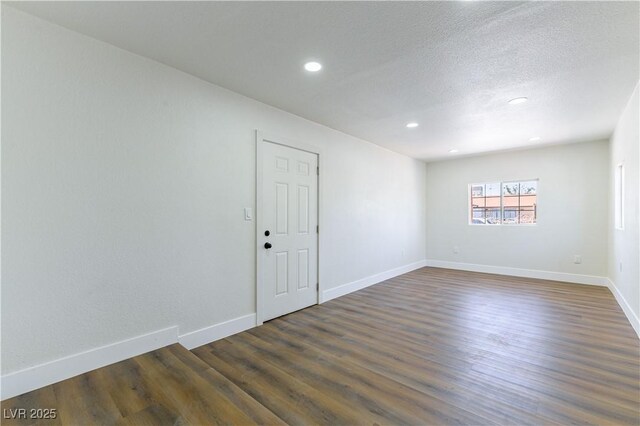 1916 Howard Ave, Las Vegas, NV 89104 - spare room with recessed lighting, dark wood-style floors, and a textured ceiling