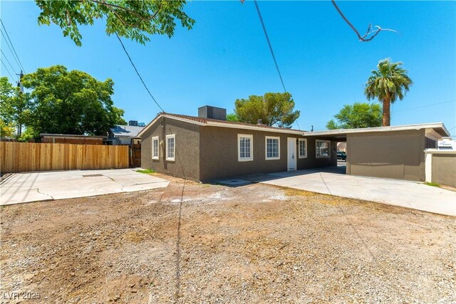 1916 Howard Ave, Las Vegas, NV 89104 - rear view of house with stucco siding and a patio