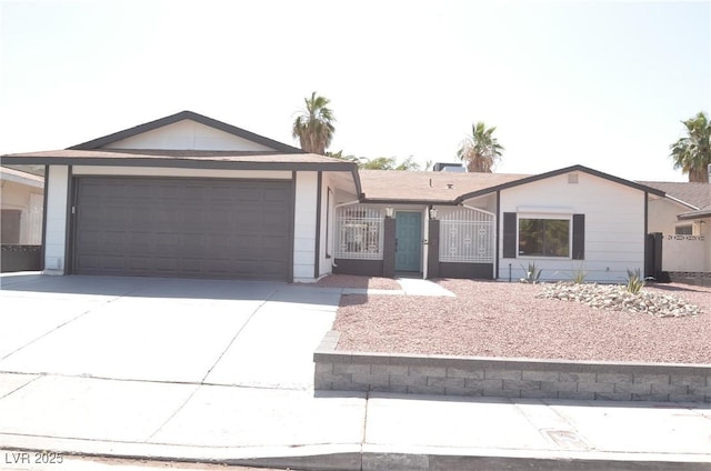 4277 Rimcrest Rd, Las Vegas, NV 89121 - ranch-style house with an attached garage, concrete driveway, and a gate