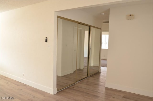 4277 Rimcrest Rd, Las Vegas, NV 89121 - hallway with baseboards and light wood-style floors