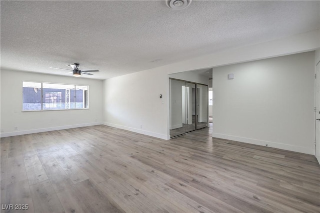 4277 Rimcrest Rd, Las Vegas, NV 89121 - empty room featuring a textured ceiling, a ceiling fan, and wood finished floors