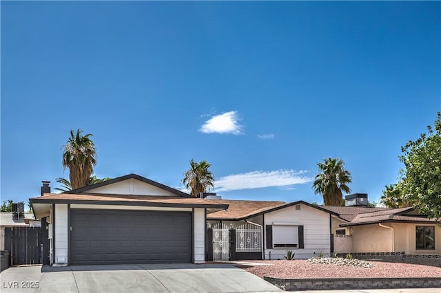 4277 Rimcrest Rd, Las Vegas, NV 89121 - ranch-style house with a garage, concrete driveway, and a gate
