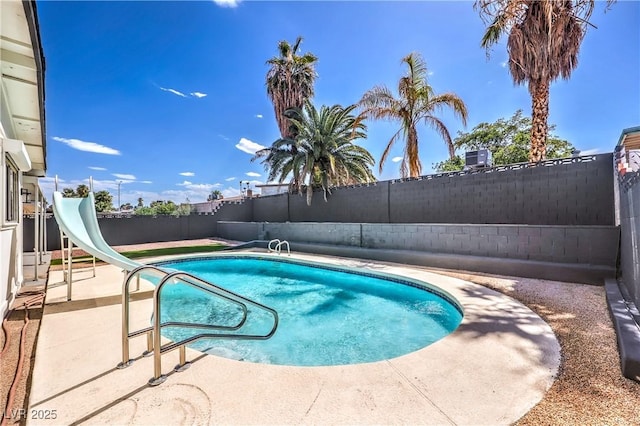 4277 Rimcrest Rd, Las Vegas, NV 89121 - view of swimming pool featuring a fenced backyard, a water slide, and a patio