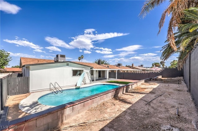 4277 Rimcrest Rd, Las Vegas, NV 89121 - view of swimming pool featuring a fenced backyard, a patio, and a water slide