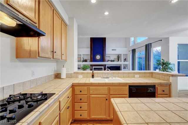 8812 Glenistar Gate Ave, Las Vegas, NV 89143 - kitchen featuring exhaust hood, black appliances, a peninsula, recessed lighting, and tile counters