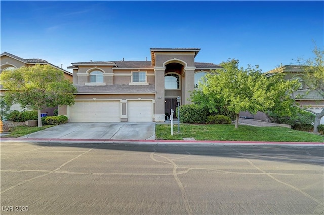 8812 Glenistar Gate Ave, Las Vegas, NV 89143 - view of front facade featuring stucco siding, driveway, a garage, and a front lawn