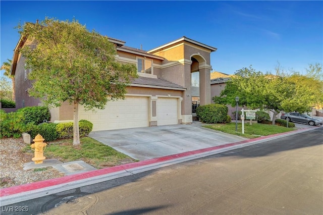 8812 Glenistar Gate Ave, Las Vegas, NV 89143 - view of front facade featuring a garage, stucco siding, and driveway