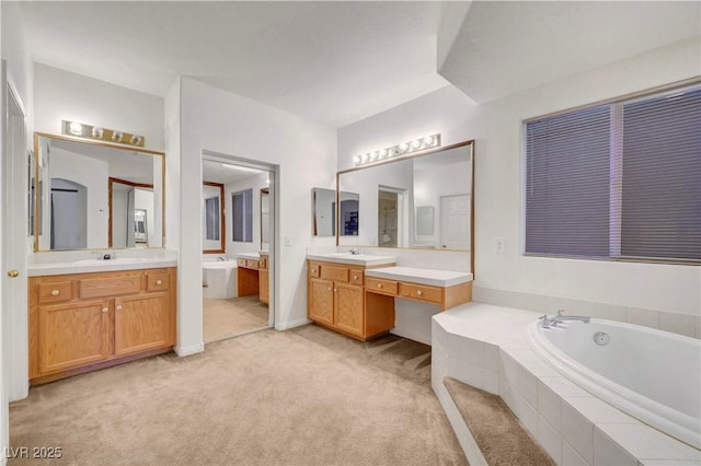 8812 Glenistar Gate Ave, Las Vegas, NV 89143 - bathroom with two vanities and a garden tub