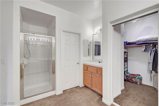 8812 Glenistar Gate Ave, Las Vegas, NV 89143 - bathroom with a stall shower, vanity, and a spacious closet