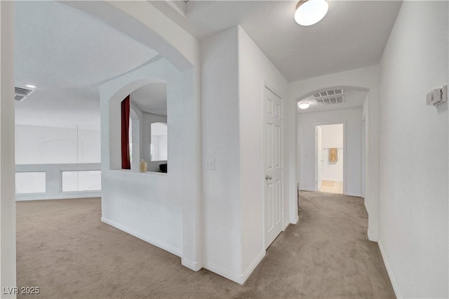 8812 Glenistar Gate Ave, Las Vegas, NV 89143 - corridor with carpet floors and arched walkways