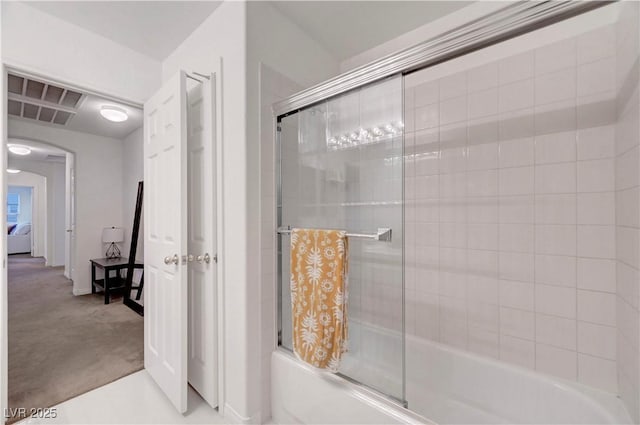 8812 Glenistar Gate Ave, Las Vegas, NV 89143 - bathroom featuring combined bath / shower with glass door
