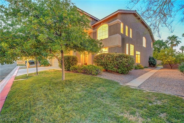 8812 Glenistar Gate Ave, Las Vegas, NV 89143 - view of front of home with stucco siding and a garage