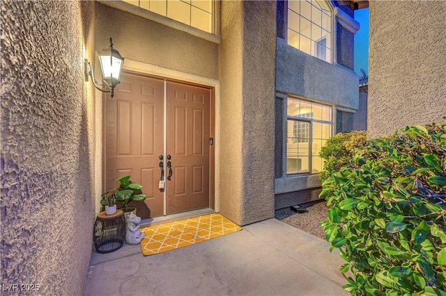 8812 Glenistar Gate Ave, Las Vegas, NV 89143 - doorway to property featuring stucco siding