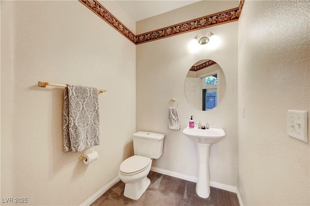 8812 Glenistar Gate Ave, Las Vegas, NV 89143 - bathroom featuring toilet and baseboards
