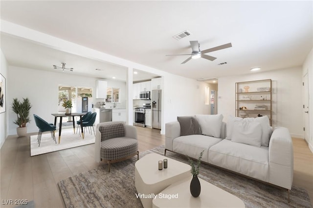 1700 Sweeney Ave, Las Vegas, NV 89104 - living room with a ceiling fan, light wood finished floors, and recessed lighting