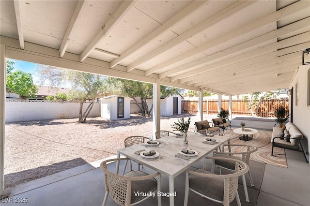 1700 Sweeney Ave, Las Vegas, NV 89104 - fenced backyard with a shed, outdoor dining space, and a patio