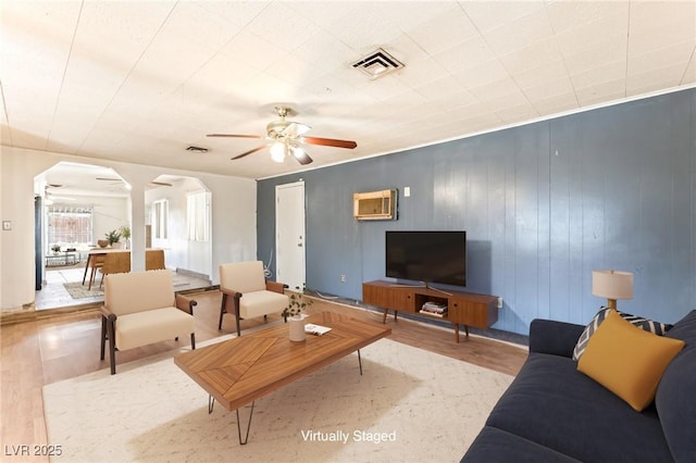 5809 Pebble Beach Blvd, Las Vegas, NV 89108 - living area featuring arched walkways, wood finished floors, and ceiling fan