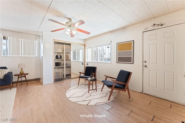 5809 Pebble Beach Blvd, Las Vegas, NV 89108 - sitting room featuring wood finished floors and a ceiling fan