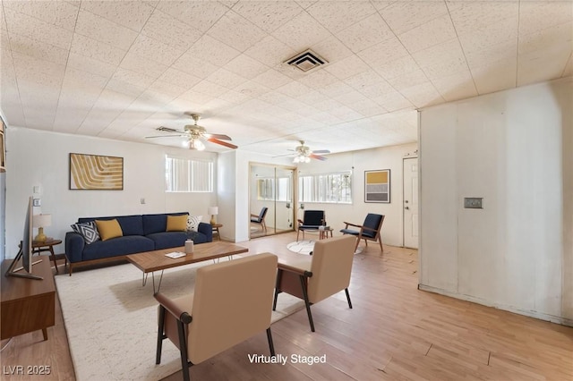 5809 Pebble Beach Blvd, Las Vegas, NV 89108 - living area with light wood-style flooring and ceiling fan