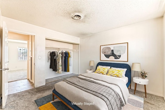 5809 Pebble Beach Blvd, Las Vegas, NV 89108 - carpeted bedroom featuring a closet and a textured ceiling