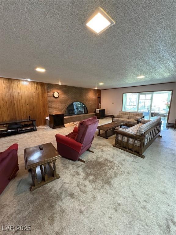 1133 Bell Ave, Ely, NV 89301 - carpeted living room with a textured ceiling