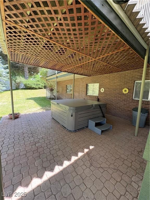 1133 Bell Ave, Ely, NV 89301 - view of patio / terrace with a hot tub