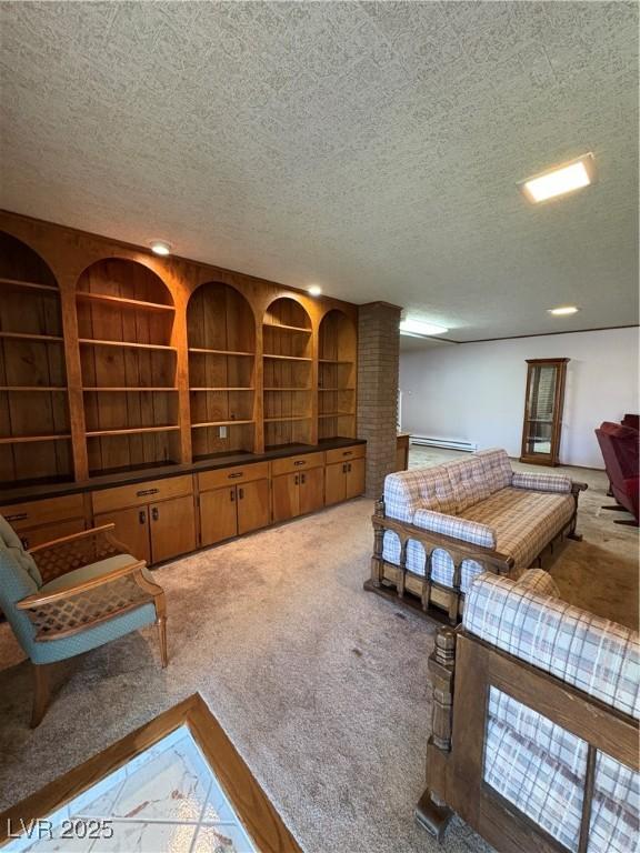 1133 Bell Ave, Ely, NV 89301 - bedroom featuring a textured ceiling, carpet, and baseboard heating