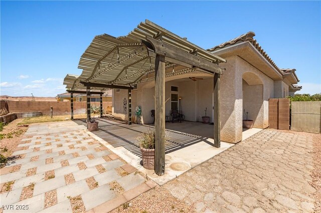 467 Muddy Peak Ct, Overton, NV 89040 - back of house with a patio area, stucco siding, a fenced backyard, and a pergola