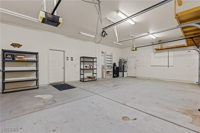 467 Muddy Peak Ct, Overton, NV 89040 - garage featuring a garage door opener and water heater