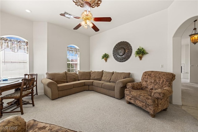 467 Muddy Peak Ct, Overton, NV 89040 - living area with carpet floors, arched walkways, and a ceiling fan