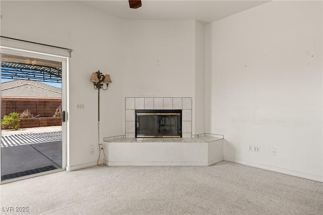 467 Muddy Peak Ct, Overton, NV 89040 - unfurnished living room featuring a tiled fireplace and a ceiling fan