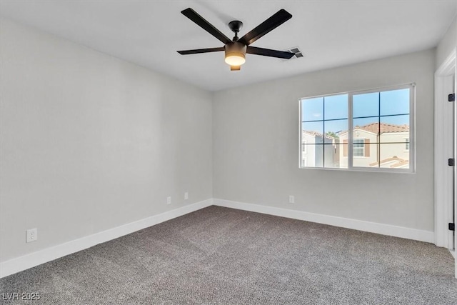 10373 Midnight Iris St, Las Vegas, NV 89183 - empty room featuring dark carpet and ceiling fan