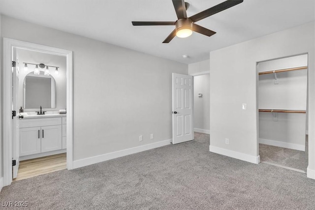 10373 Midnight Iris St, Las Vegas, NV 89183 - unfurnished bedroom with carpet flooring, ensuite bathroom, a walk in closet, and a closet