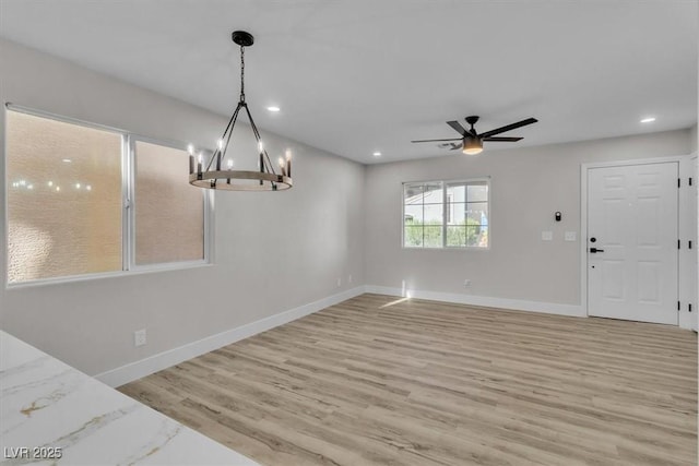 10373 Midnight Iris St, Las Vegas, NV 89183 - unfurnished dining area with a chandelier, light wood finished floors, ceiling fan, and recessed lighting
